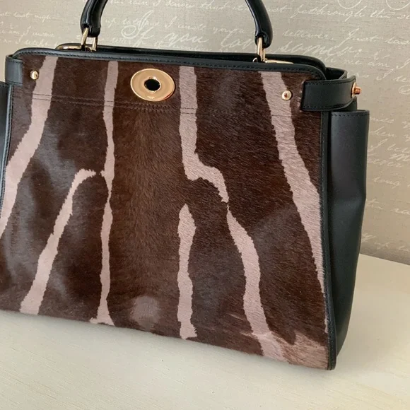 Coach,calf hair and leather top handle
Bag - Picture 10 of 14